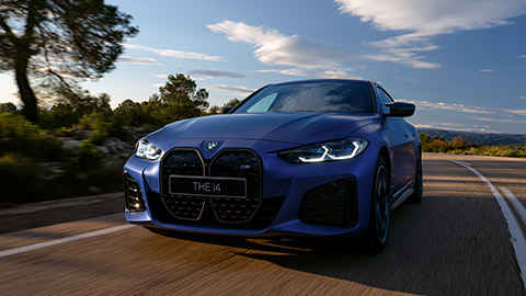 BMW i Series BMW i4 M50 three-quarter front view driving on the street