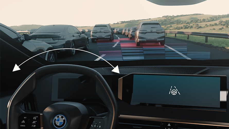 Vue BMW de l’intérieur avec volant Vue BMW de l’intérieur avec volant donnant sur route avec véhicules