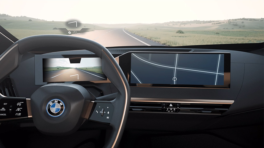 Vue BMW de l’intérieur avec volant Vue BMW de l'intérieur avec volant donnant sur route