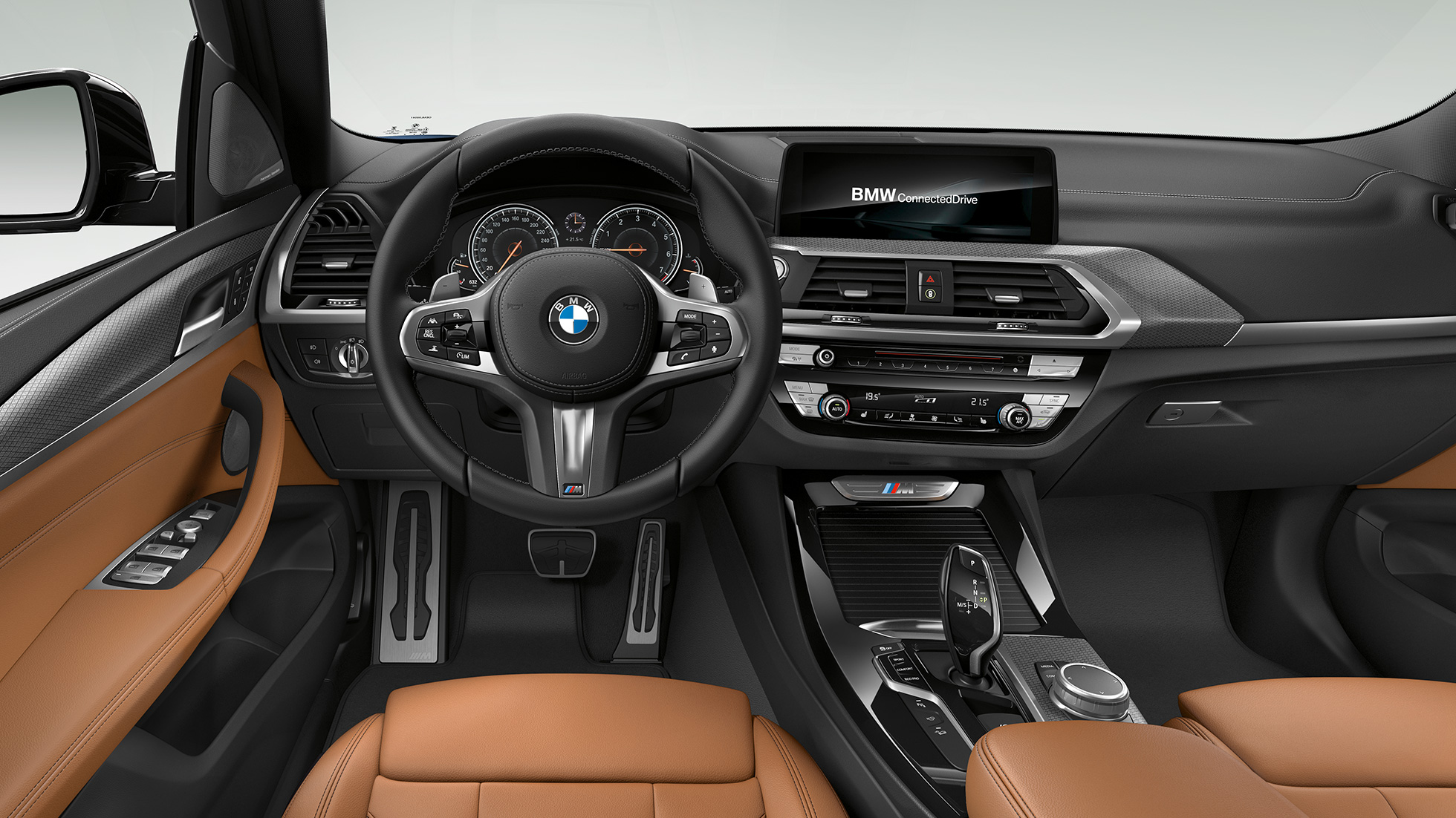 BMW X3 M40i and BMW X3 M40d, cockpit. Intérieur des BMW X3 M40i et BMW X3 M40d, habitacle avec volant M en cuir et sièges M sport.